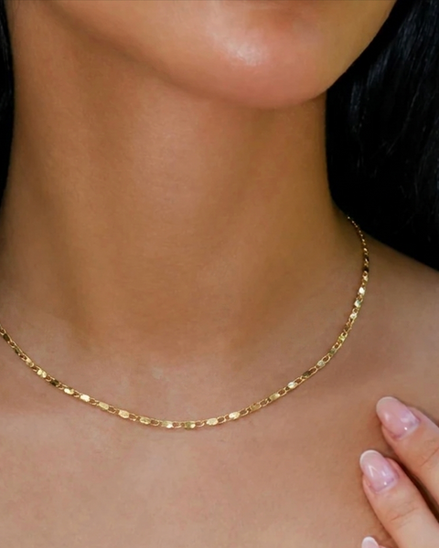 Gold-colored chain necklace from İrva Collection featuring a sleek, elegant design with a delicate link chain.