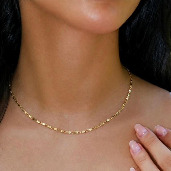 Gold-colored chain necklace from İrva Collection featuring a sleek, elegant design with a delicate link chain.