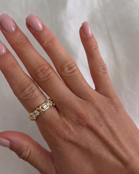 Silver XOXO ring from İrva Collection with intricate design and polished finish, stylish jewelry accessory.