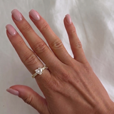 İrva Collection Tek Taş Yüzük with a prominent central gemstone and sleek silver band, showcasing elegant jewelry design.