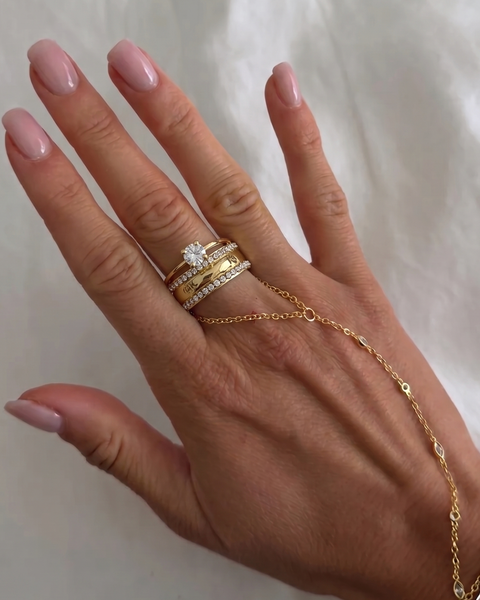 Gold Queen Ring from İrva Collection featuring intricate design and elegant craftsmanship, displayed on a neutral background.