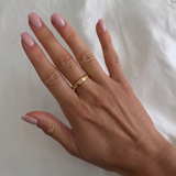 İnce Tılsım yüzük by İrva Collection featuring a delicate gold band with a small engraved talisman pendant.