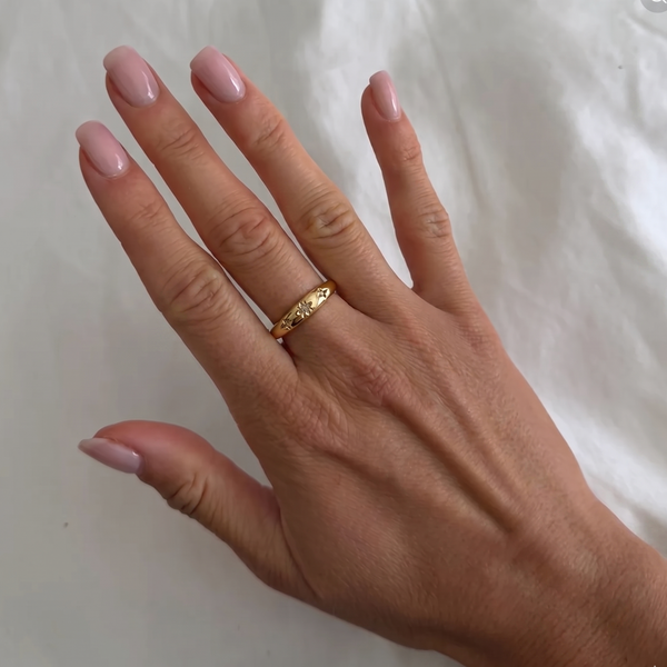 İnce Tılsım yüzük by İrva Collection featuring a delicate gold band with a small engraved talisman pendant.