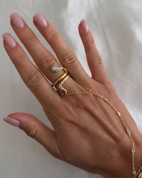 Silver snake ring with gemstone accents from İrva Collection, featuring intricate detailing and a sleek, modern design.