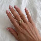 Silver leaf ring with embedded stones from İrva Collection, showcasing intricate design and sparkling details.