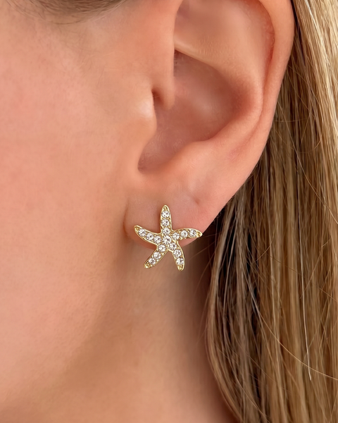 Dusk Küpe by İrva Collection featuring elegant gold hoop earrings with a modern, minimalist design.