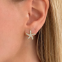 Dusk Küpe by İrva Collection featuring elegant gold hoop earrings with a modern, minimalist design.