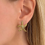 İrva Collection Bloom Küpe with delicate floral design and gold-tone finish, showcasing elegant dangle earrings for women.