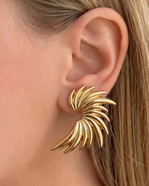 İrva Collection angel wing earrings featuring delicate silver design, perfect for a subtle and elegant jewelry accent.