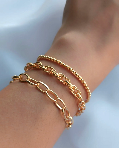 Three stylish İrva Collection bracelet sets featuring elegant designs with beads and charms, perfect for accessorizing.
