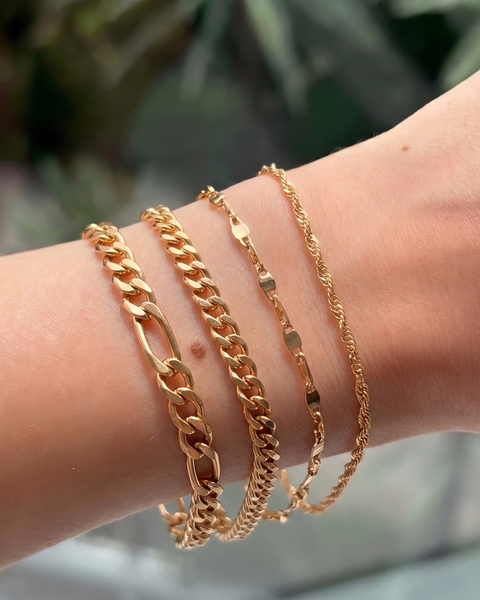 Set of four mixed metal chain bracelets from İrva Collection, featuring different styles and textures in the jewelry image.