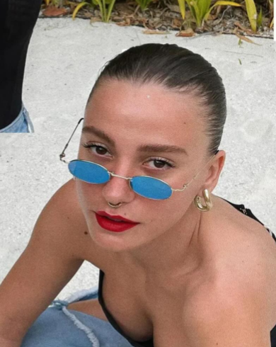 Serenay Sarıkaya inspired İrva Collection halka küpe with gold-tone finish and minimalist design, close-up of the stylish earrings.