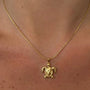 Large turtle pendant necklace from İrva Collection, featuring a detailed turtle charm on a chain.