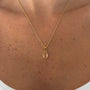 İrva Collection Kararmaz Pembe Taşlı Kolye featuring pink gemstone pendant on a delicate chain.