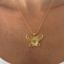 İrva Collection Kararmaz Masumiyet Müzesi Füsun Kelebek kolye with delicate butterfly pendant on a chain, displayed on a neutral background.