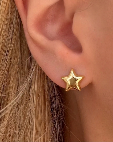 Silver I AM STAR hoop earrings by İrva Collection, featuring sleek steel design with star-shaped accents.