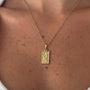 Gold-plated Gemini constellation pendant necklace by İrva Collection, featuring a delicate chain and celestial star design.