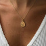 Kararmaz Mineli Fidan Kolye by İrva Collection featuring a delicate pendant with mint-colored gemstone on a silver chain.