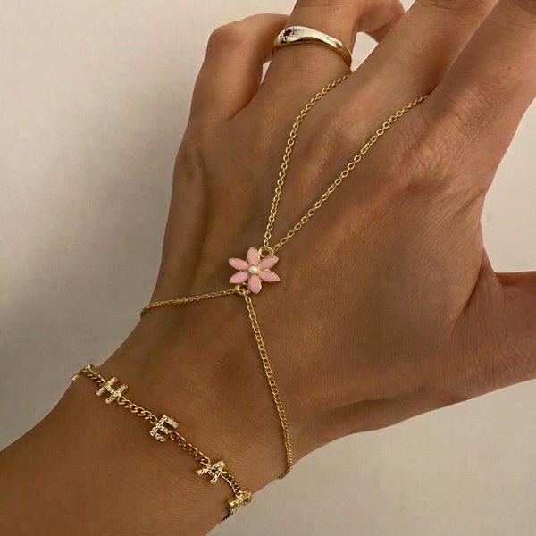 Pembe Çiçek Şahmeran from İrva Collection featuring intricate design with pink flower motifs on a traditional metal piece