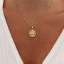 Silver Kararmaz Papatya necklace from İrva Collection featuring a delicate daisy pendant on a fine chain.