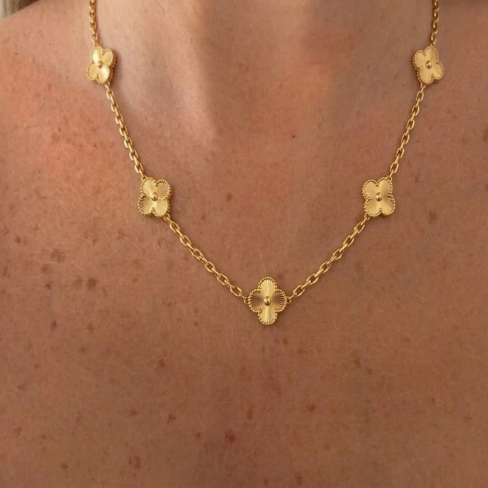 Gold VC necklace by İrva Collection featuring a sleek, minimalist design with a delicate chain and subtle pendant.