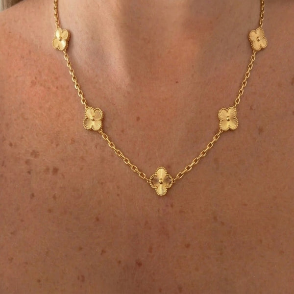 Gold VC necklace by İrva Collection featuring a sleek, minimalist design with a delicate chain and subtle pendant.