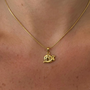 Silver snail pendant necklace from İrva Collection featuring a detailed snail charm on a delicate chain.
