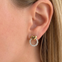 Silver heart-shaped earrings with decorative gemstones from İrva Collection, featuring a stylish and elegant design.