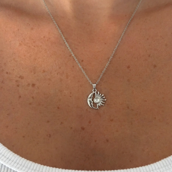 Silver Beyaz Mineli Güneş kolye from İrva Collection featuring a sun pendant with a crescent moon design.