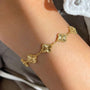 Kararmaz Yonca Bileklik from İrva Collection featuring a delicate jewelry bracelet with leaf-inspired design in silver tone.