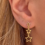 İrva Collection Sallantılı Yıldız Küpe with dangling star design, shiny gold finish, stylish jewelry for women.