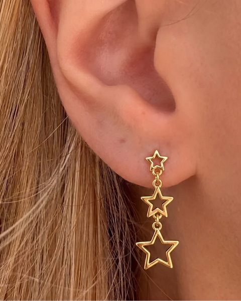İrva Collection Sallantılı Yıldız Küpe with dangling star design, shiny gold finish, stylish jewelry for women.