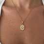 Kararmaz Mineli Plaka Güneş Kolye by İrva Collection featuring a sun-shaped pendant with turquoise stones on a delicate chain