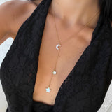 Silver Y-shaped charm necklace with Gemini symbols, featuring intricate chain details from İrva Collection.