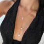 Silver Y-shaped charm necklace with Gemini symbols, featuring intricate chain details from İrva Collection.