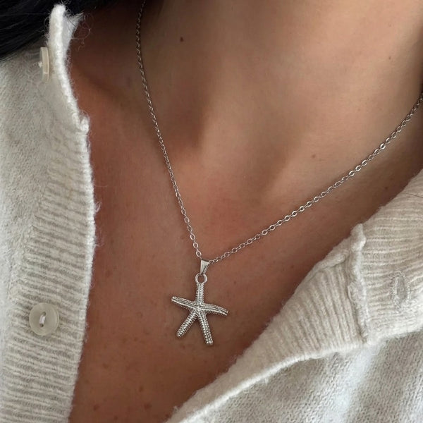 Gold Deniz Yıldızı kolye by İrva Collection featuring a starfish pendant on a delicate chain.