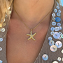 İrva Collection Kararmaz Viral Pinterest Deniz Yıldızı kolye with a starfish pendant on a delicate chain.