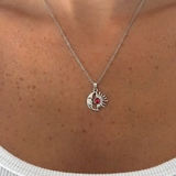 Silver Beyaz Mineli Güneş Kolye with delicate sun pendant from İrva Collection on a chain.