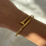 İrva Collection Kararmaz Çivi Bileklik featuring a sleek, modern design with nail-inspired accents in a stylish bracelet form.