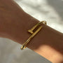 İrva Collection Kararmaz Çivi Bileklik featuring a sleek, modern design with nail-inspired accents in a stylish bracelet form.