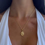 Silver heart pendant necklace from İrva Collection's Mineli Kalp Plaka Kolye with delicate chain and engraved heart charm.