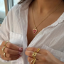 İrva Collection I'm Good Kolye featuring a delicate design with elegant pendant on a silver chain.