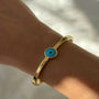 İrva Collection Kararmaz Nazar Kelepçe, silver bracelet with Nazar eye charm, on a white background.