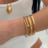 Set of three İrva Collection Kararmaz beaded bracelets featuring modern designs with metallic accents and adjustable closures.