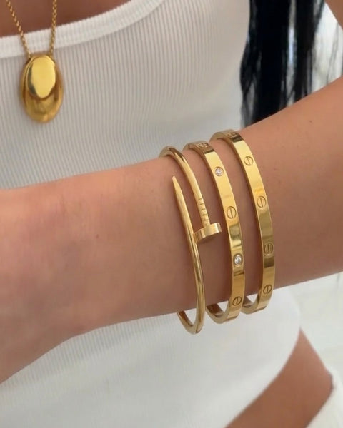Set of three İrva Collection Kararmaz beaded bracelets featuring modern designs with metallic accents and adjustable closures.