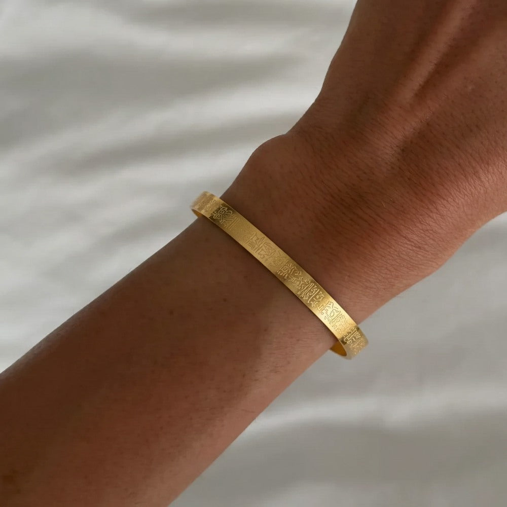 Silver Ayetel Kürsi bracelet with ornate design from İrva Collection displayed on a white background.