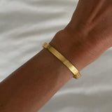 Silver Ayetel Kürsi bracelet with ornate design from İrva Collection displayed on a white background.