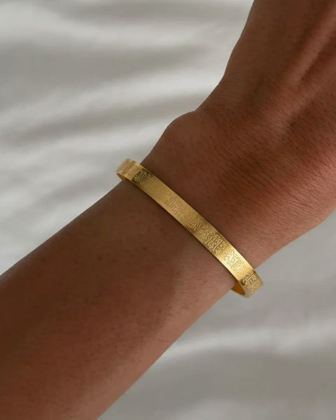 Silver Ayetel Kürsi bracelet with ornate design from İrva Collection displayed on a white background.